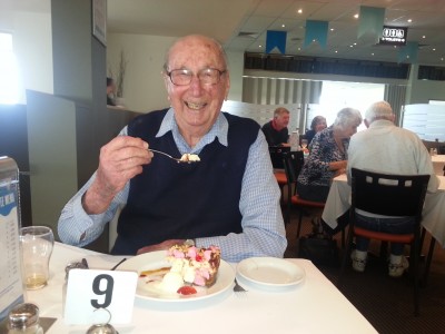 Older man eating cake