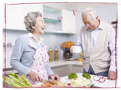 Older Asian people cooking 